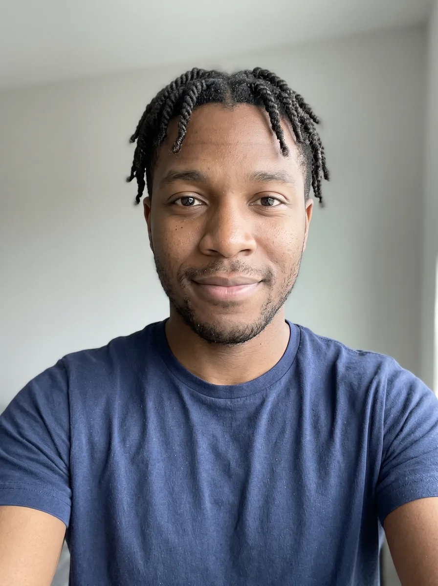 A man with short twists, before a new cut